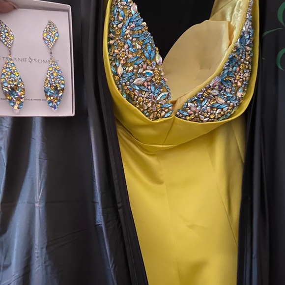 Yellow dress-$700;coral jumpsuit-$125;orange-$250; lavender-$175;cocktail-$60 - Picture 5 of 6